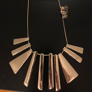 Tags on gold costume jewelry necklace